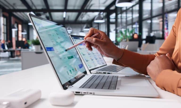 Female Payroll Manager Utilizing Digital App For Staff Salary Payments
